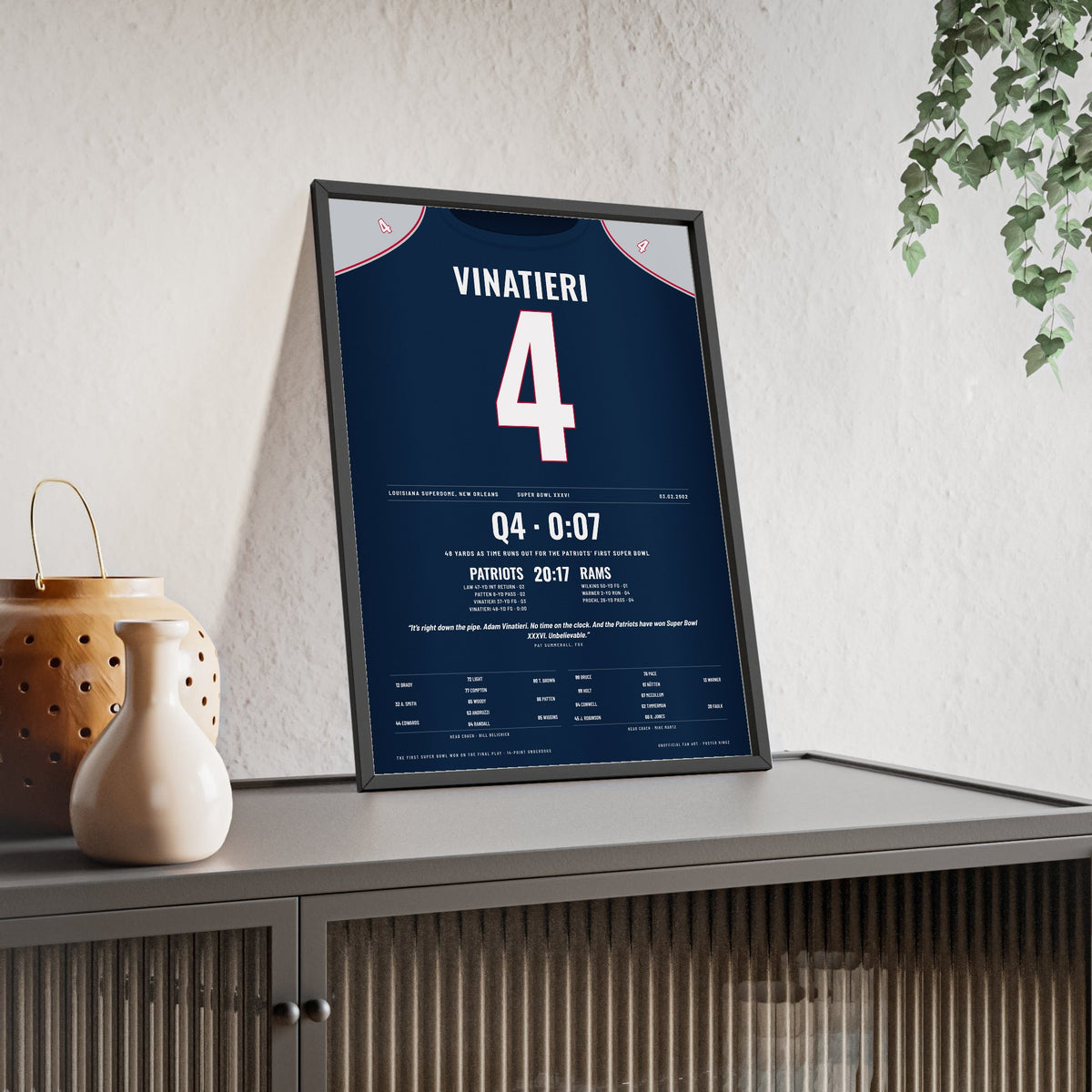 New England Patriots Super Bowl XXXVI Poster - Adam Vinatieri 4 Winning Kick Jersey Print framed and leaning on a sideboard