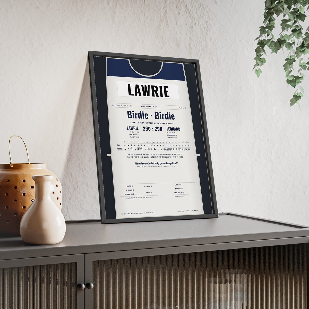 Paul Lawrie Carnoustie 1999 Golf Poster - Caddie Bib Playoff Win Print framed and leaning on a sideboard
