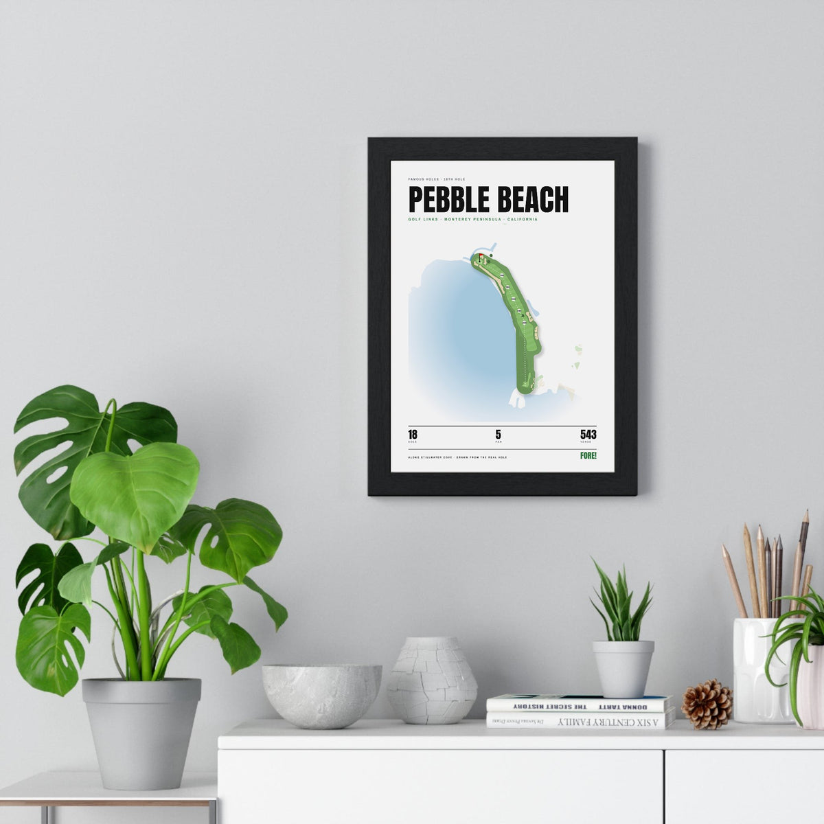 Pebble Beach 18th Hole White print framed on a living room wall