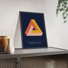 Penrose Triangle print framed and leaning on a sideboard