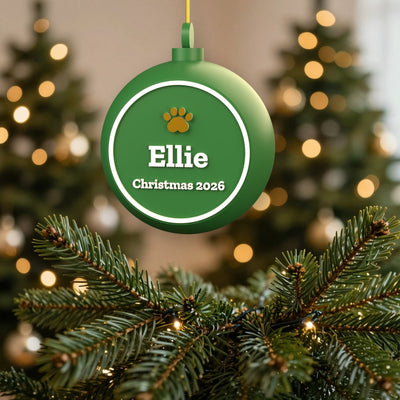 Personalised Dog Bauble - green bauble with Ellie and a gold paw on the Christmas tree
