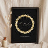 Personalised Christmas Wreath Print - black and gold wreath print leaning on a shelf