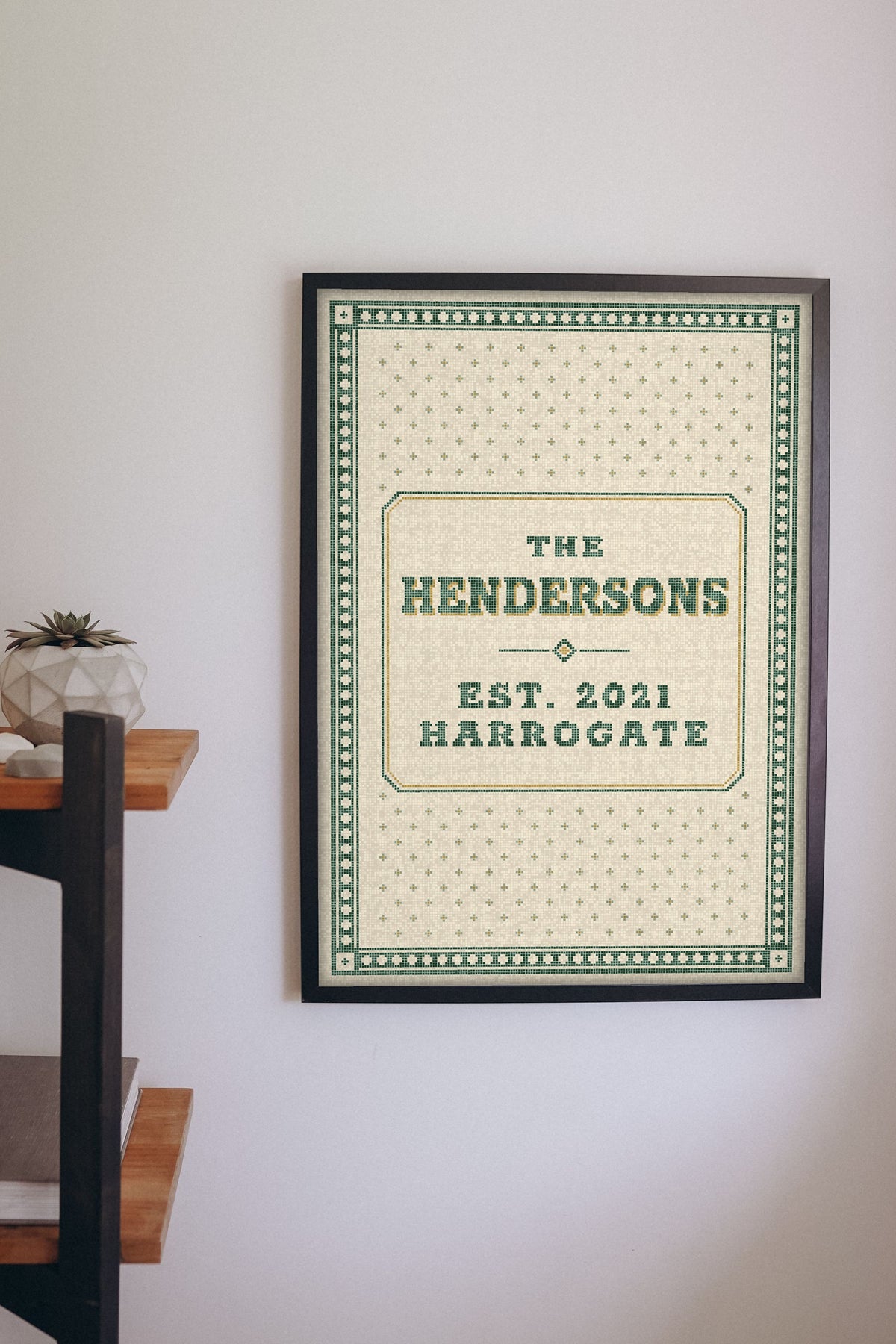 Personalised Family Name Mosaic Print - green and cream mosaic name print on a hallway wall