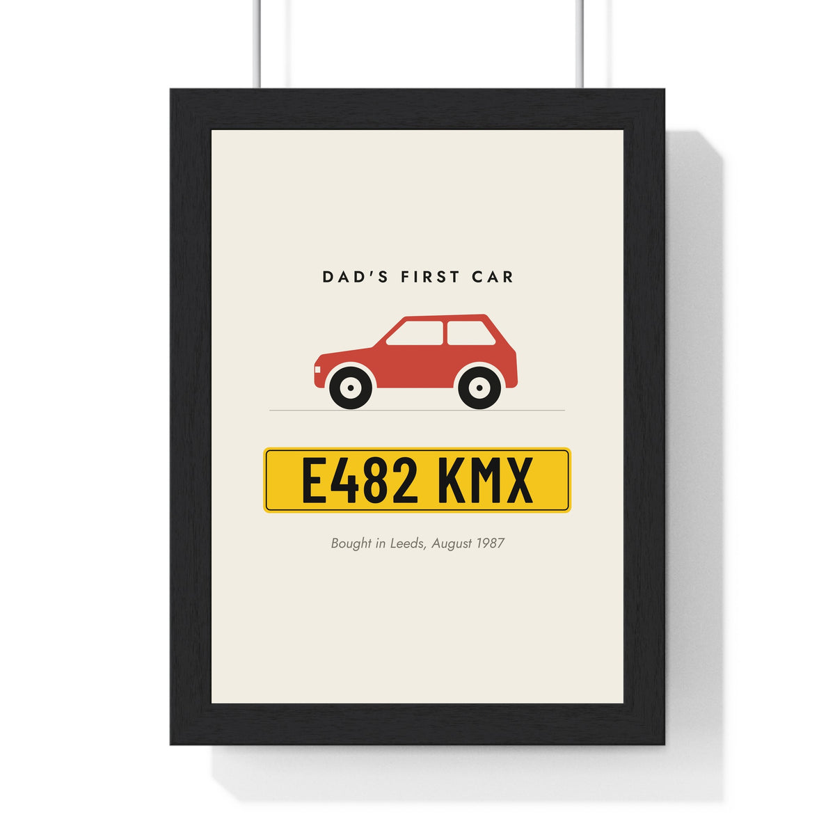 Personalised Number Plate Print - framed cream number plate print with a red hatchback above a yellow plate