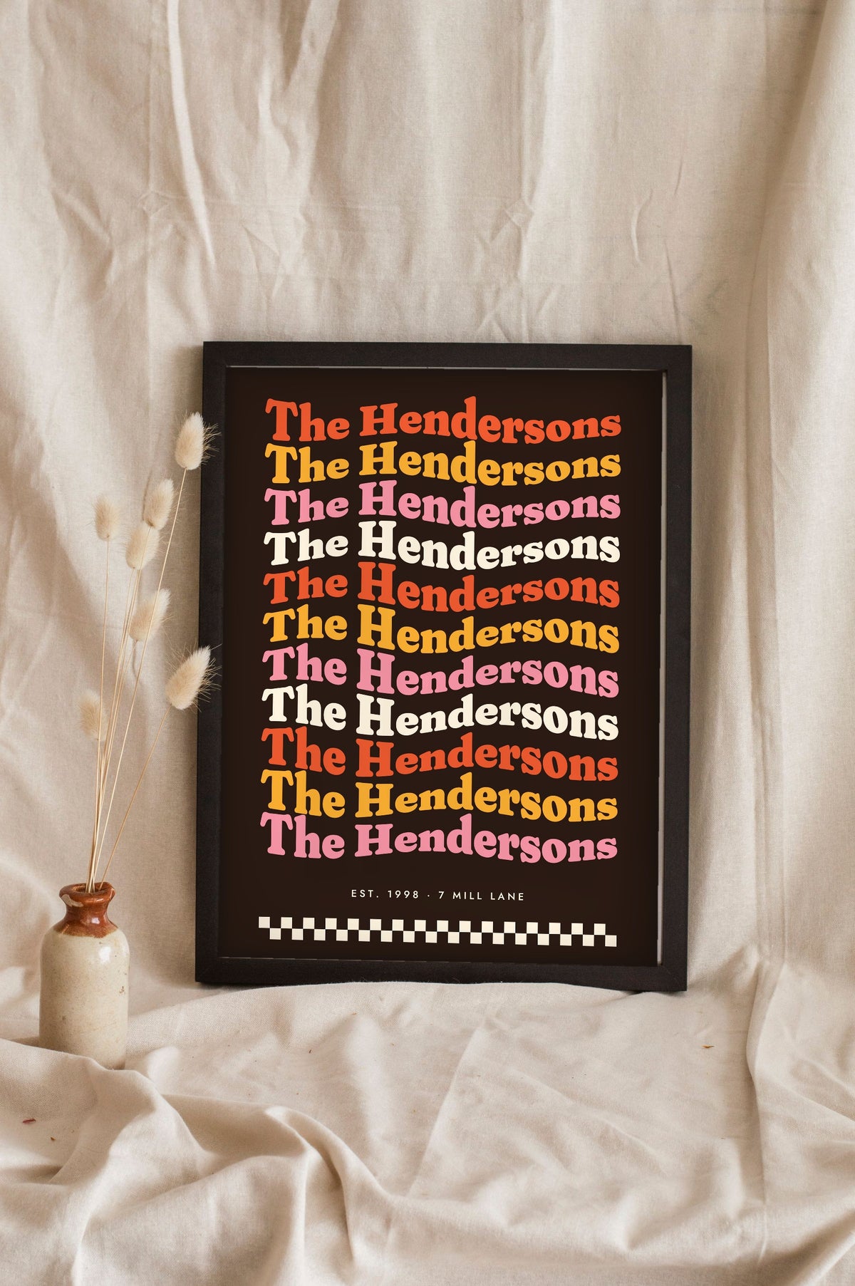 Personalised Retro Wavy Name Print - dark retro wavy family name print leaning on a shelf