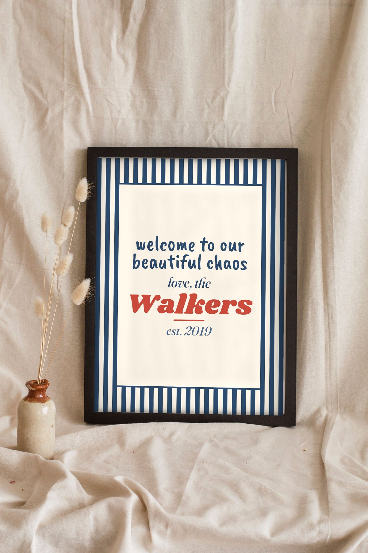Personalised Welcome Print - navy ticking stripe beautiful chaos print leaning on a shelf