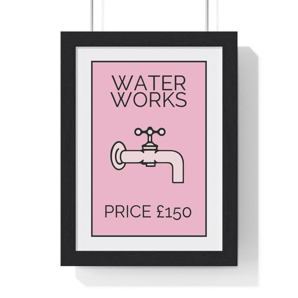 Pink Water Works Monopoly-inspired bathroom poster in a black frame on a white wall