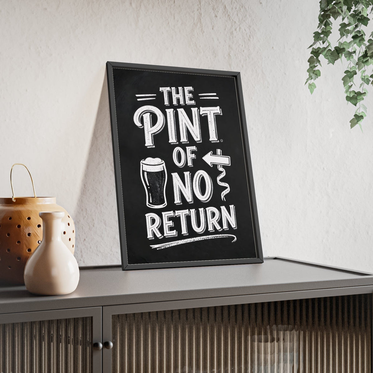 The Pint Of No Return Chalkboard Print framed and leaning on a sideboard
