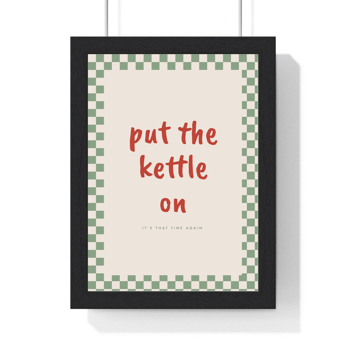 Put the Kettle On Print framed in a black frame, ready to hang