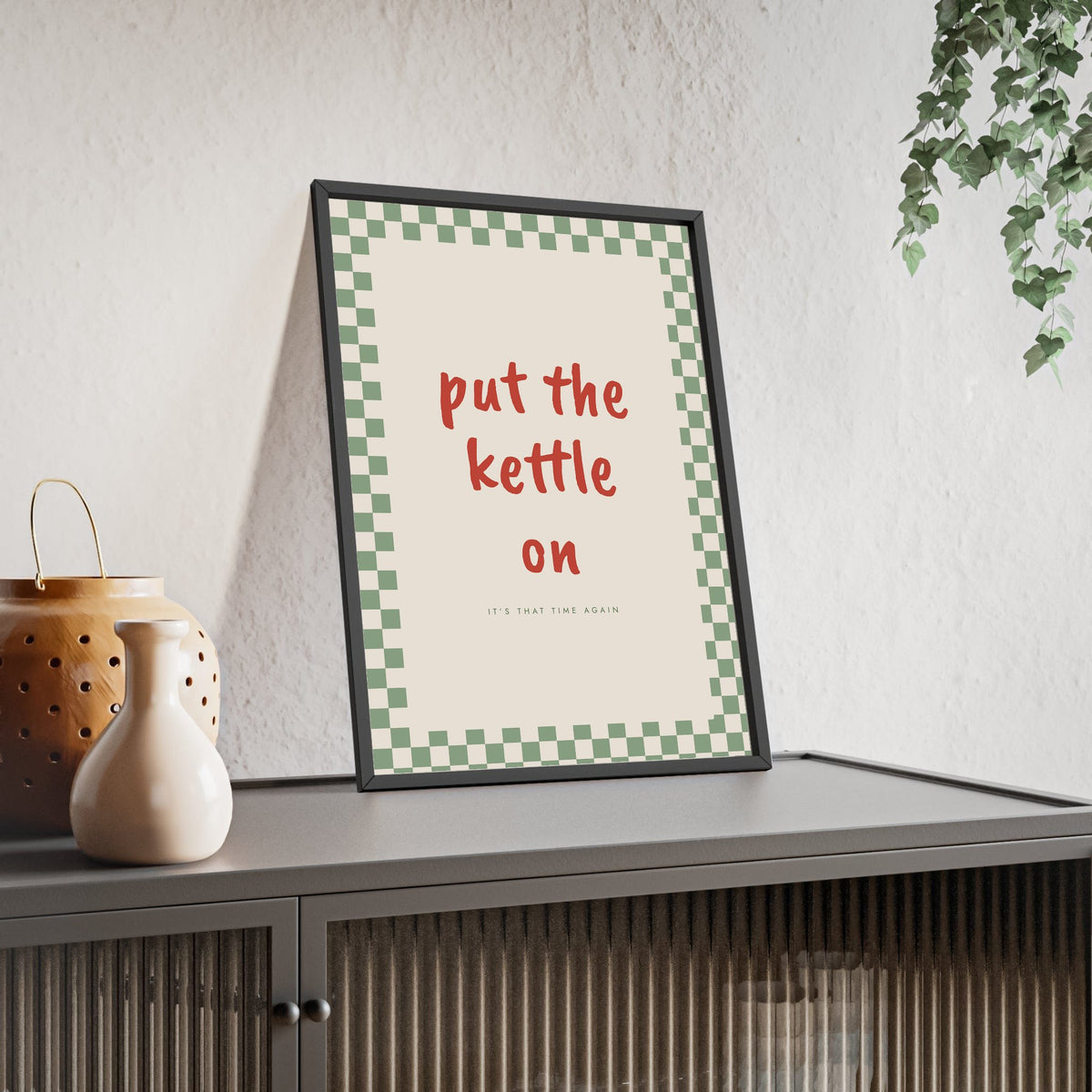 Put the Kettle On Print framed and leaning on a sideboard