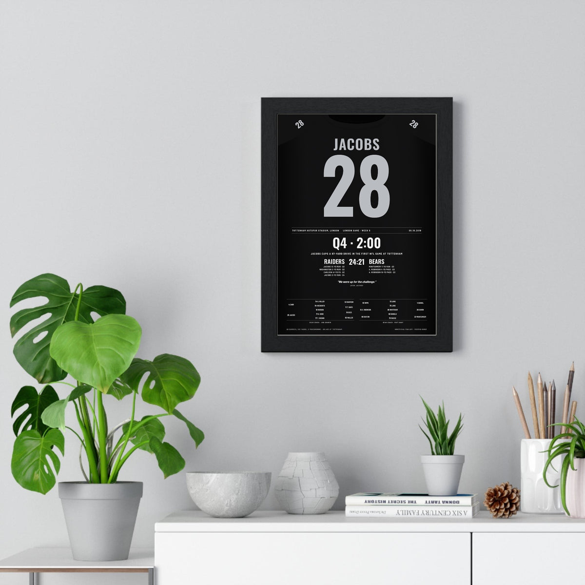 Raiders London 2019 Poster - Josh Jacobs 28 First NFL Game at Tottenham Jersey Print framed on a living room wall