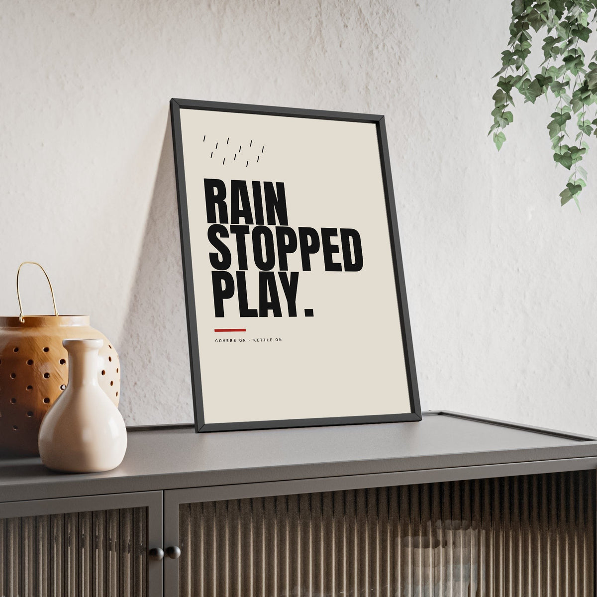 Rain Stopped Play Cricket print framed and leaning on a sideboard
