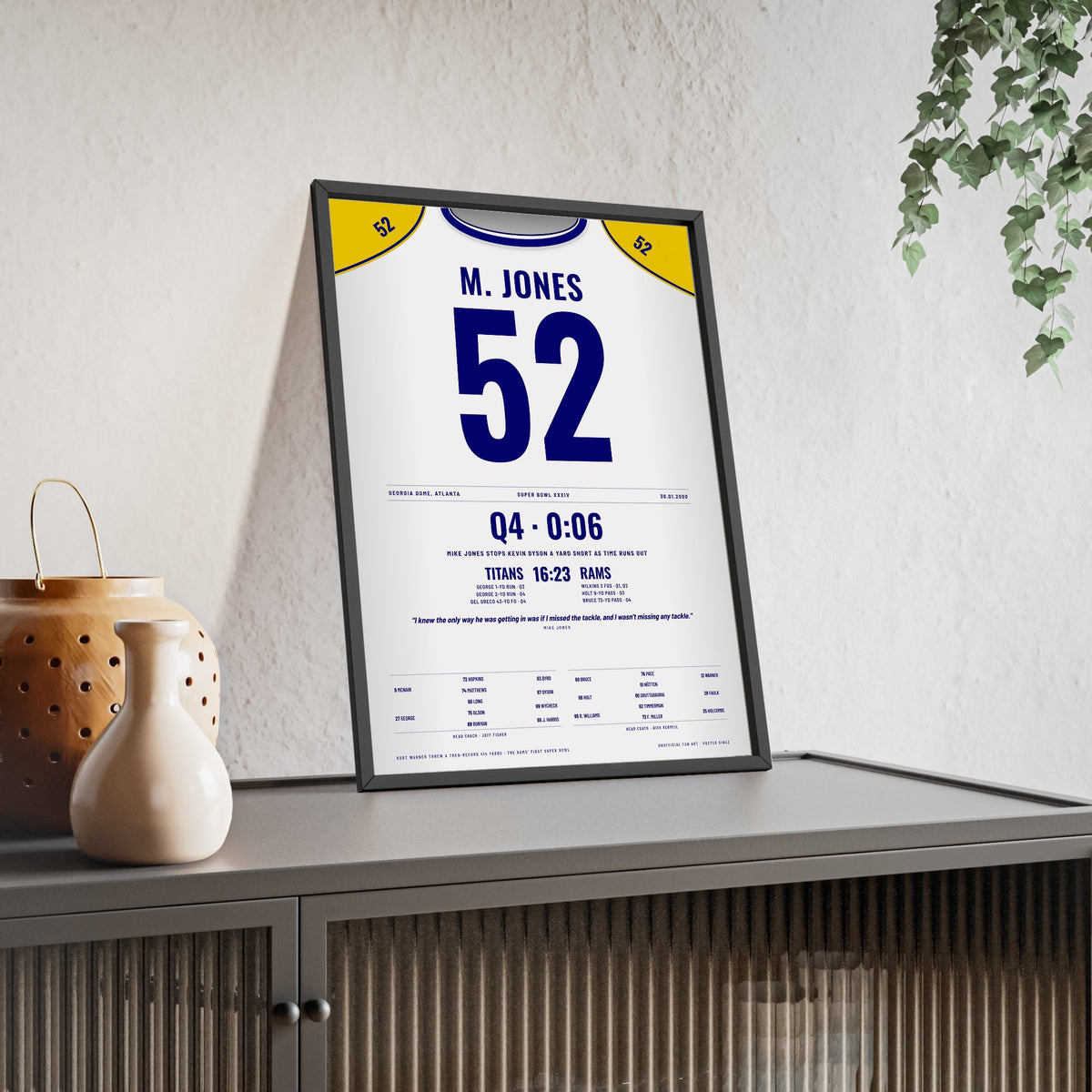St. Louis Rams Super Bowl XXXIV Poster - Mike Jones 52 The Tackle Jersey Print framed and leaning on a sideboard