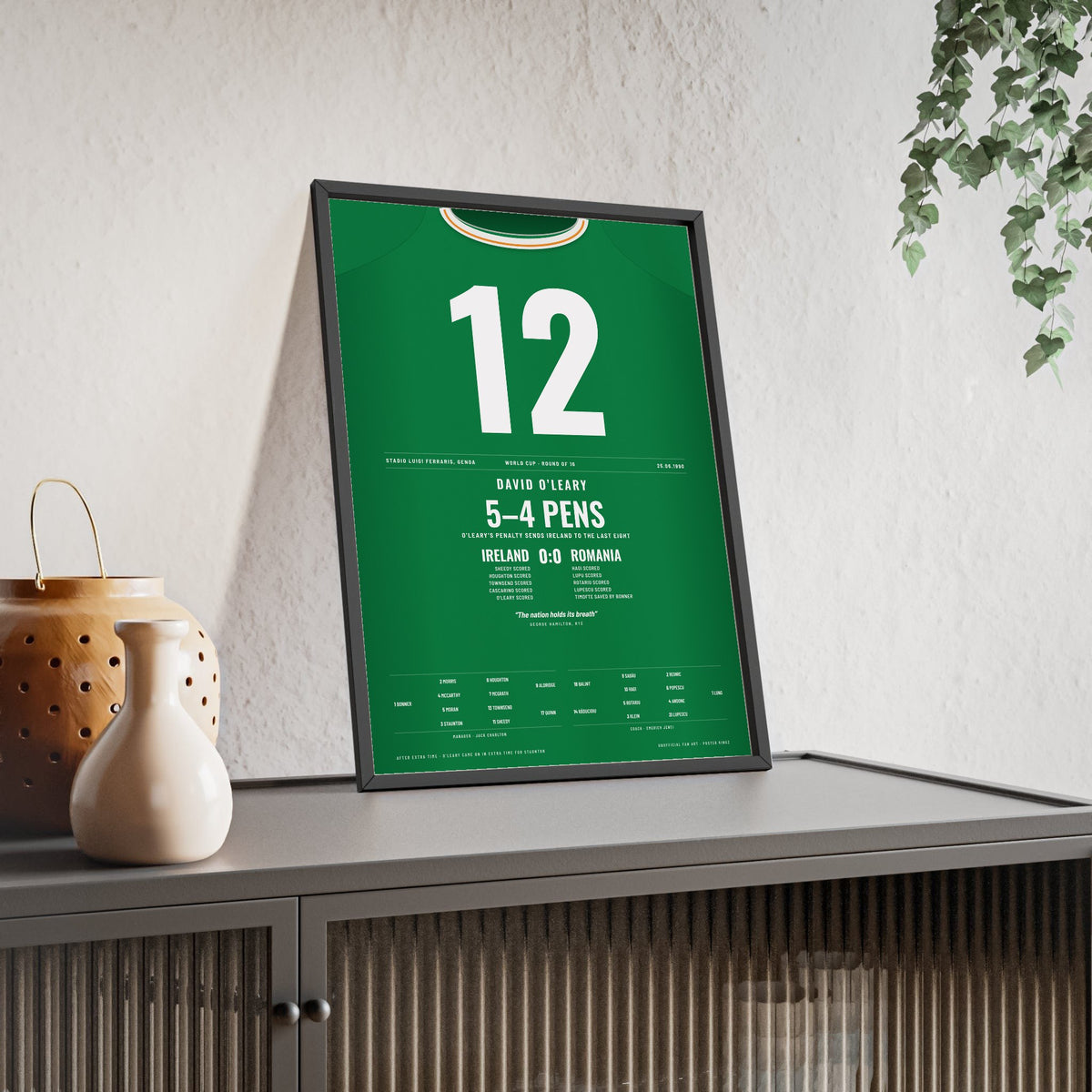 Republic of Ireland World Cup 1990 Poster - David O’Leary 12 Winning Penalty v Romania Shirt Print framed and leaning on a sideboard