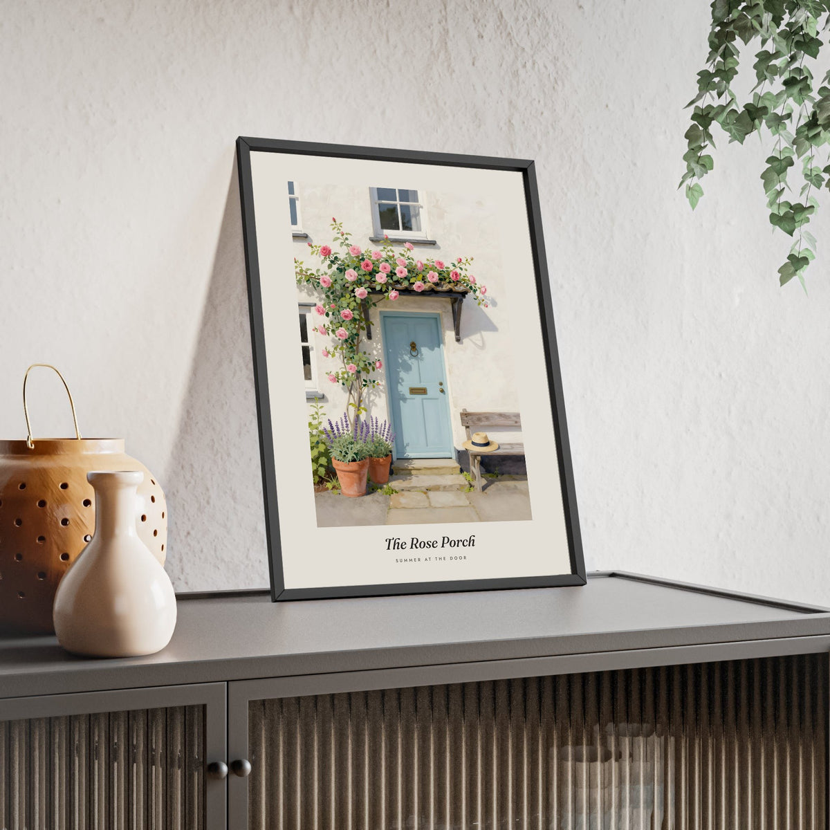 The Rose Porch Print framed and leaning on a sideboard