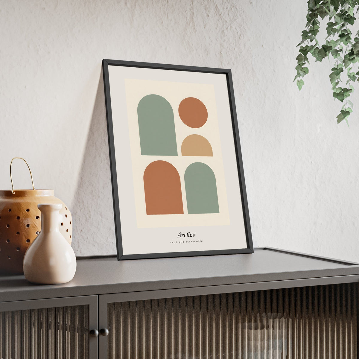 Sage Arches Abstract Print - Home Office Wall Art framed and leaning on a sideboard
