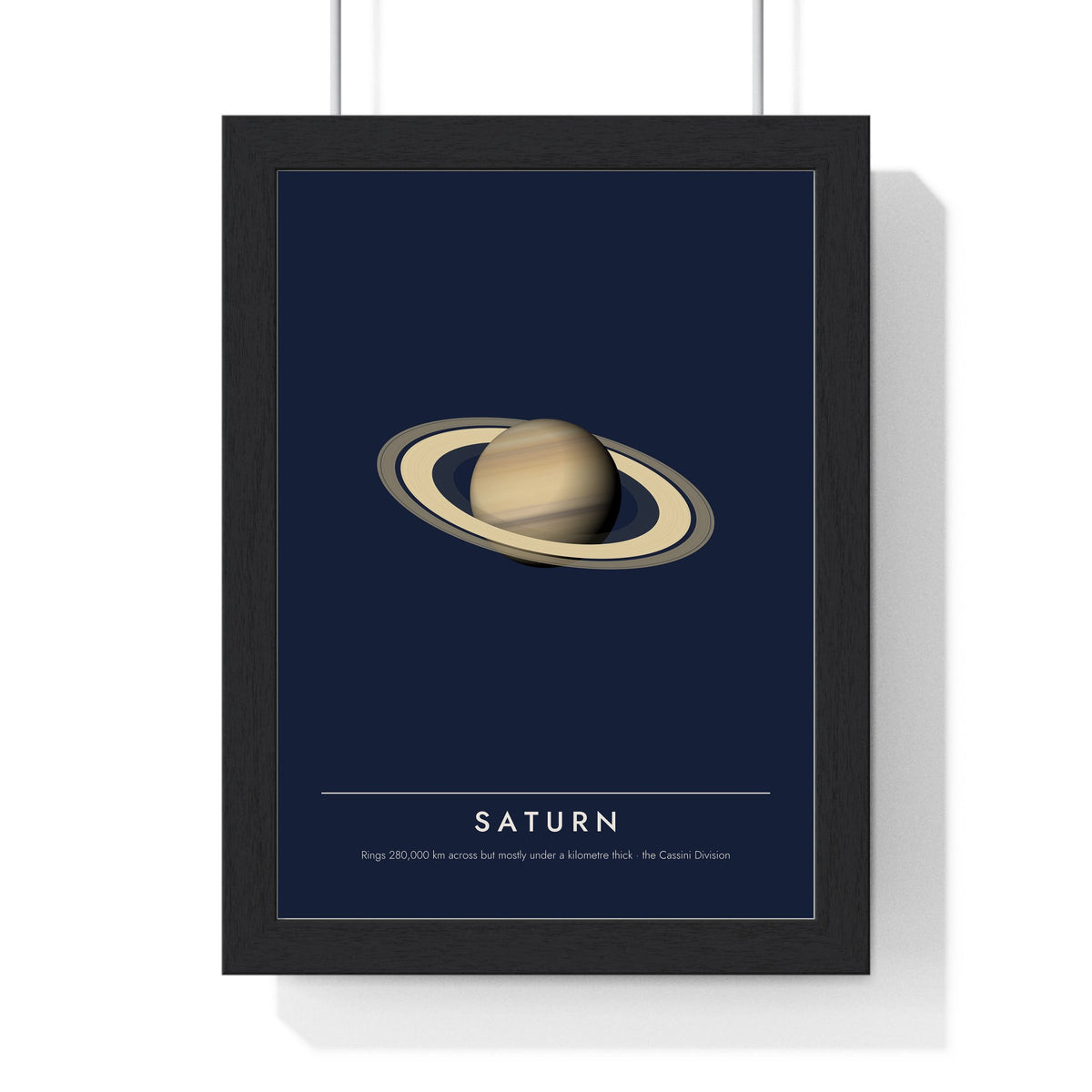 Saturn print framed in a black frame, ready to hang