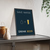 Save Water Drink Beer Print framed and leaning on a sideboard