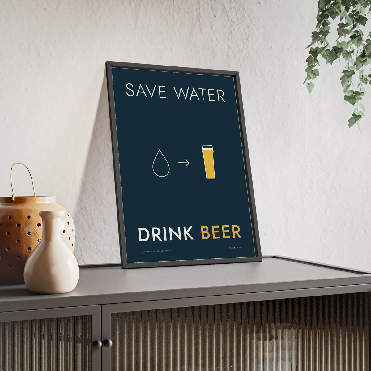 Save Water Drink Beer Print framed and leaning on a sideboard