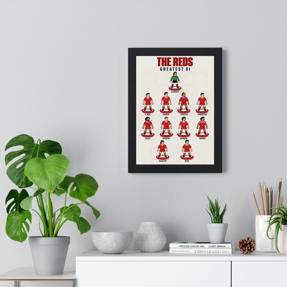 Liverpool Greatest XI poster framed on a living room wall