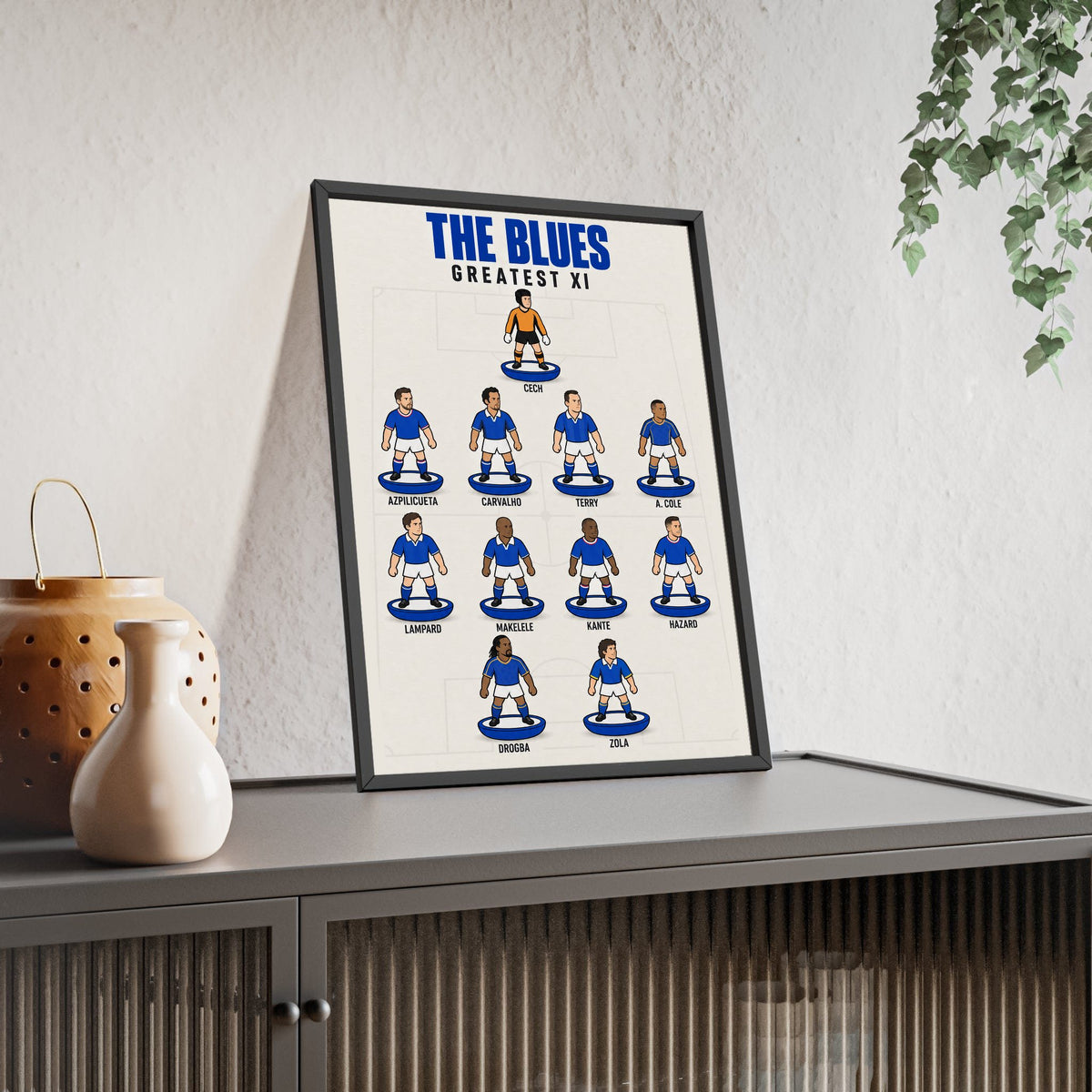 Chelsea Greatest XI framed print leaning on a sideboard