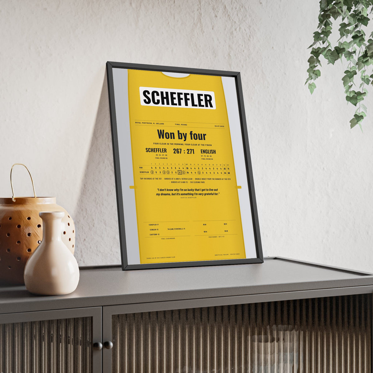 Scottie Scheffler Royal Portrush 2025 Golf Poster - Caddie Bib 4 Shot Win Print framed and leaning on a sideboard