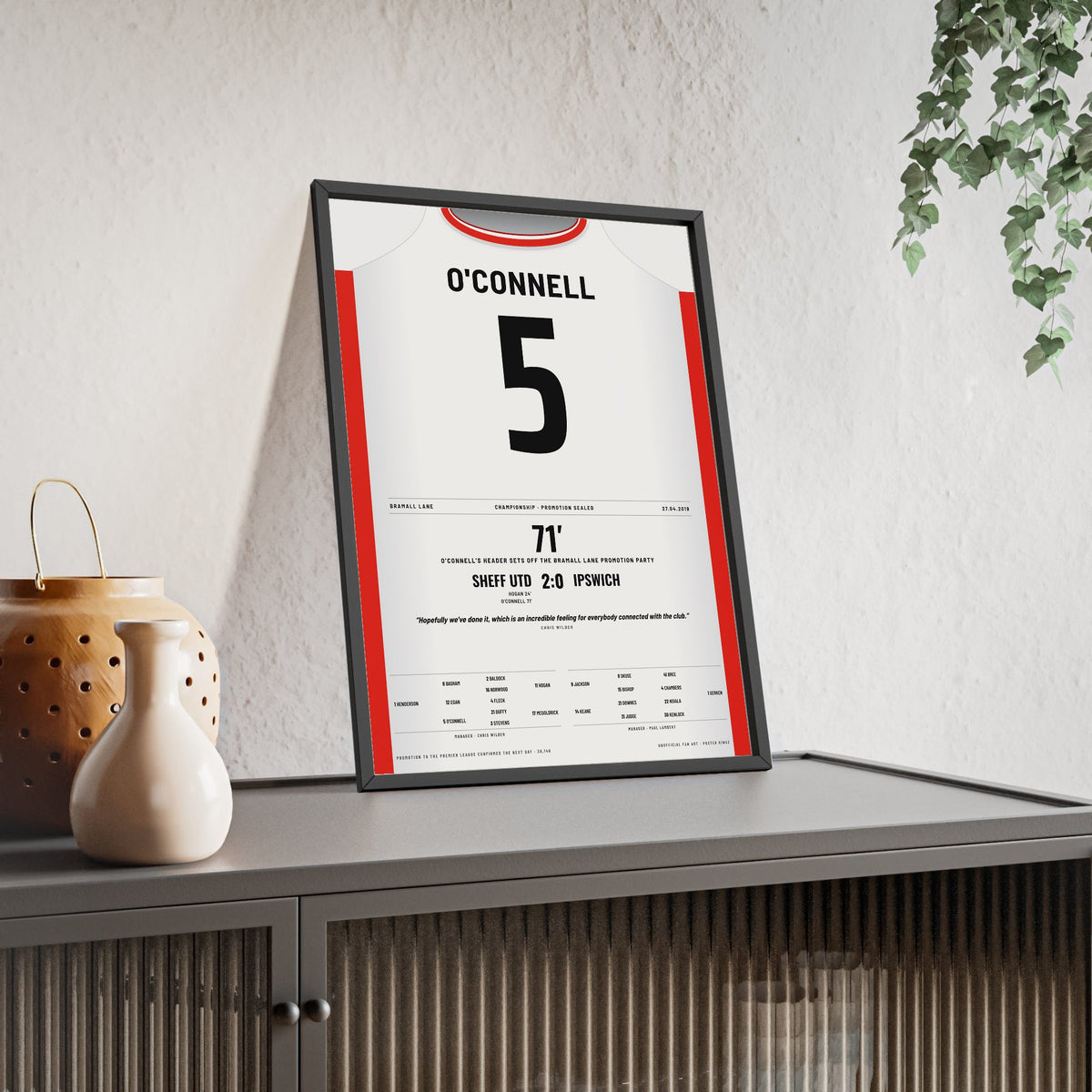 Sheffield United Promotion 2019 Poster - Jack O'Connell 5 Bramall Lane Shirt Print framed and leaning on a sideboard