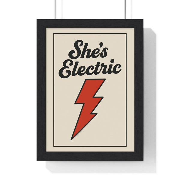 She's Electric Oasis poster framed with red lightning bolt design on white wall