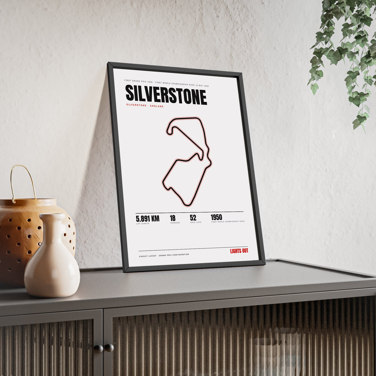 Silverstone Circuit print White framed and leaning on a sideboard