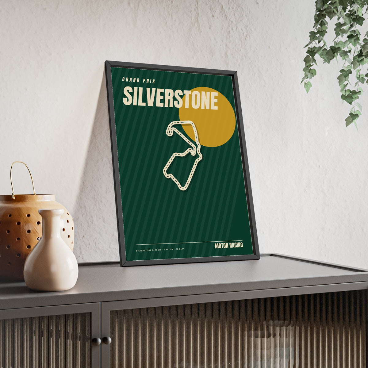 Silverstone Retro Grand Prix print framed and leaning on a sideboard