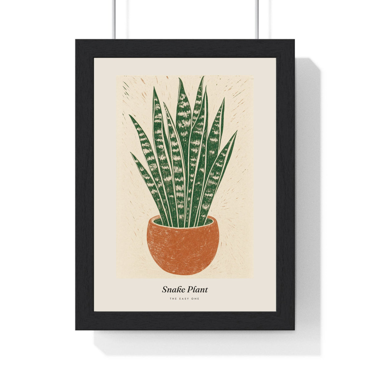 Snake Plant Lino Print framed in a black frame, ready to hang
