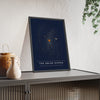 Solar System print framed and leaning on a sideboard