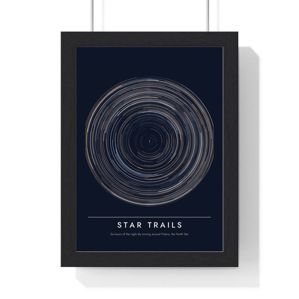 Star Trails print framed in a black frame, ready to hang
