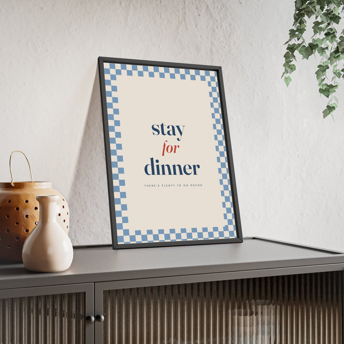Stay for Dinner Print framed and leaning on a sideboard