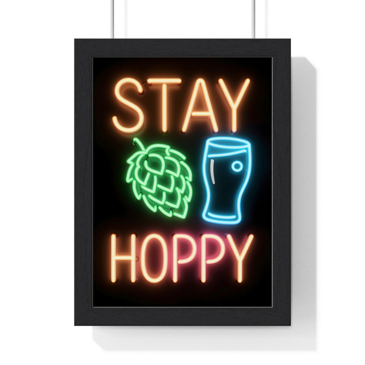 Stay Hoppy Neon Print framed in a black frame, ready to hang