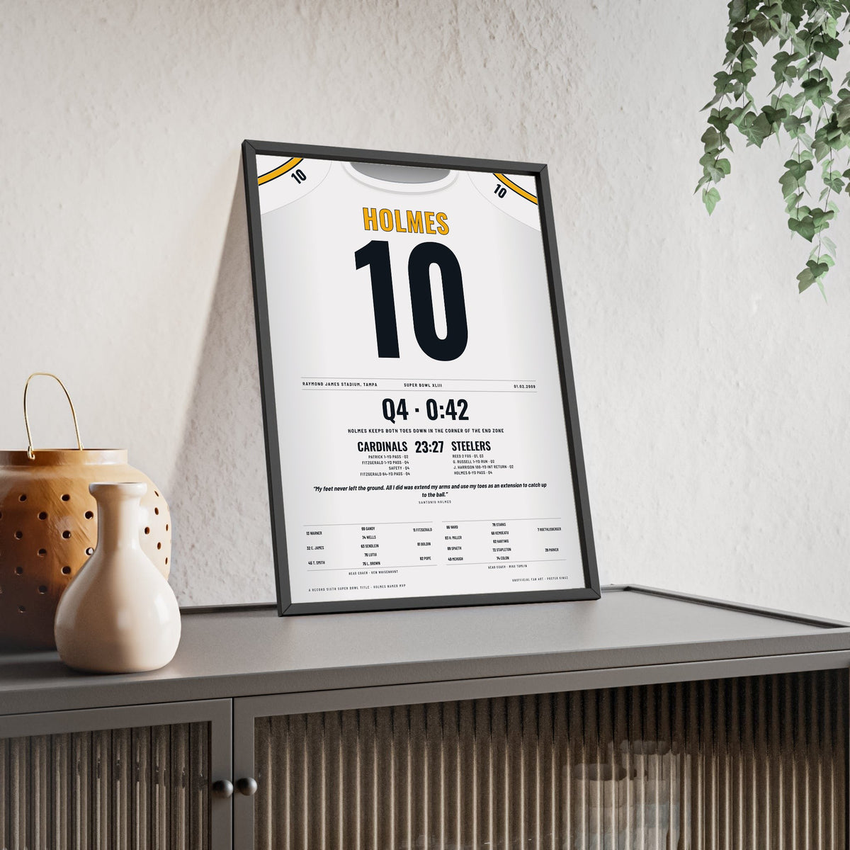 Pittsburgh Steelers Super Bowl XLIII Poster - Santonio Holmes 10 Toe-Tap Touchdown Jersey Print framed and leaning on a sideboard