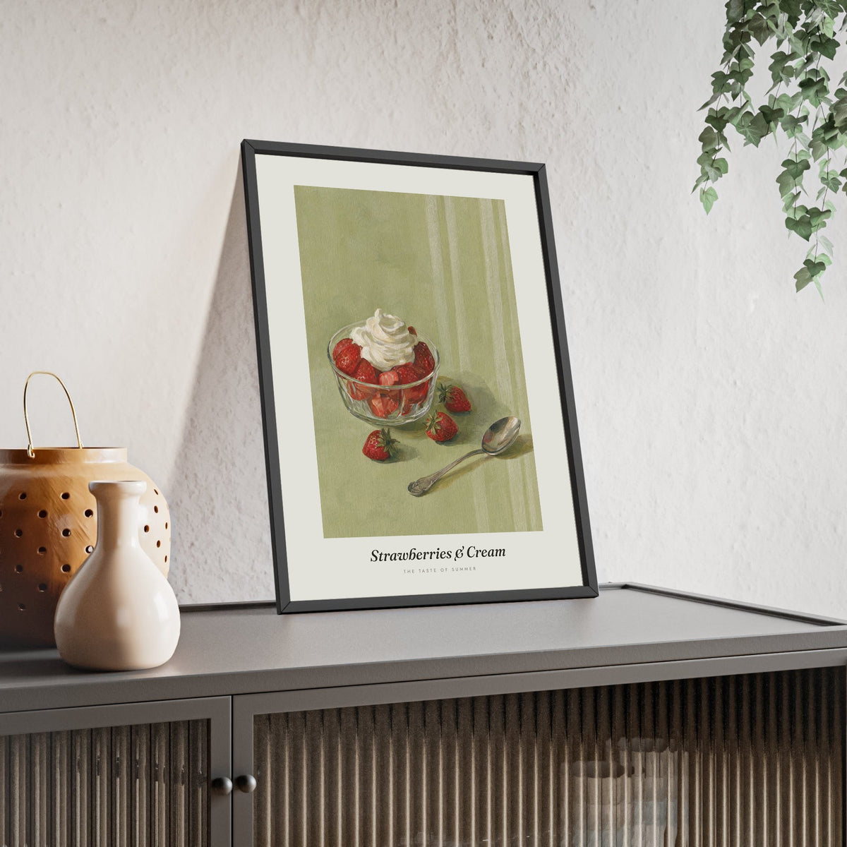 Strawberries and Cream Print framed and leaning on a sideboard