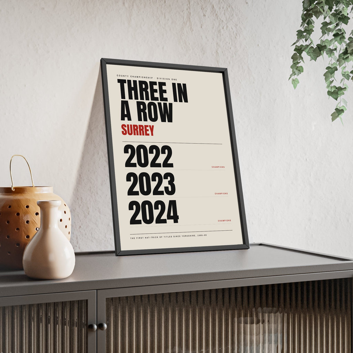Surrey County Champions 2022-2024 print framed and leaning on a sideboard