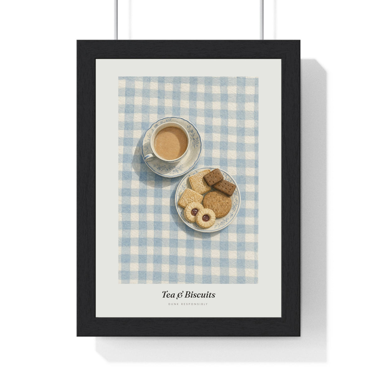 Tea and Biscuits Print framed in a black frame, ready to hang