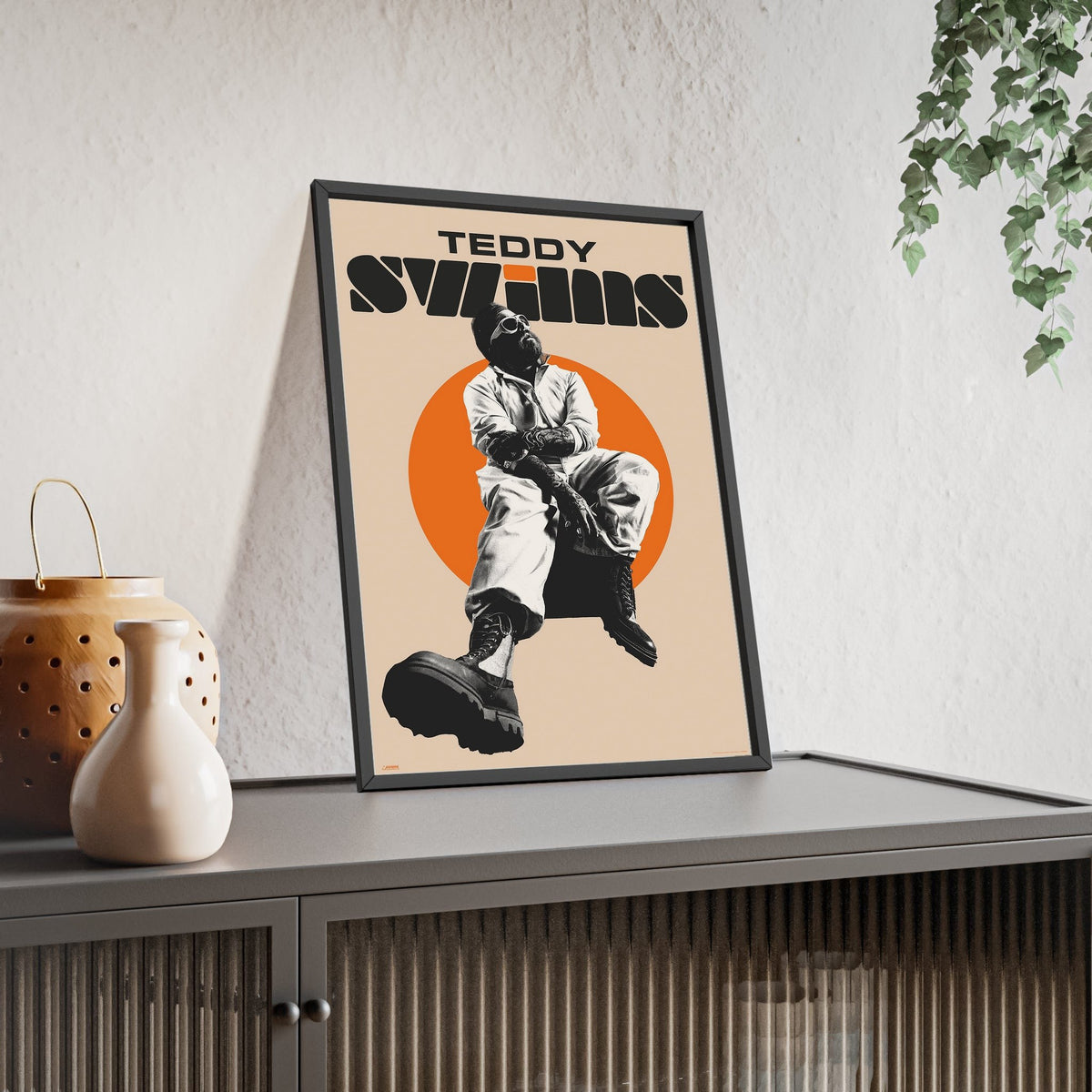 Teddy Swims Maxi Poster framed and leaning on a sideboard