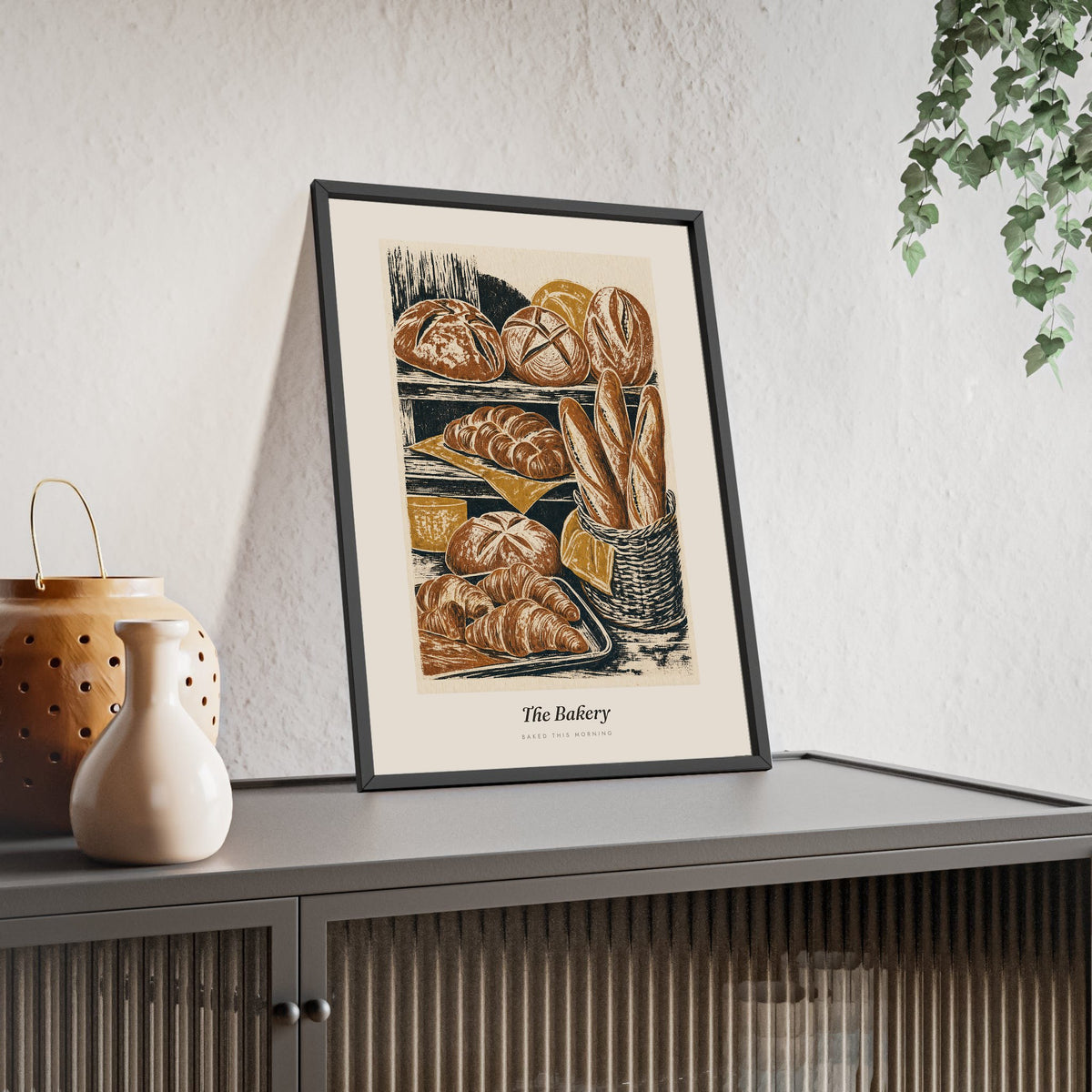 The Bakery Print framed and leaning on a sideboard