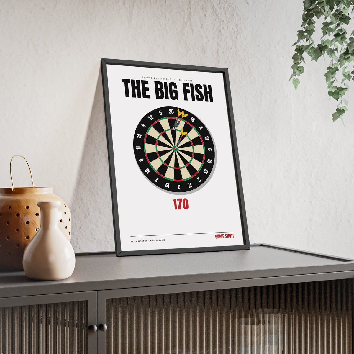 The Big Fish 170 Darts print framed and leaning on a sideboard