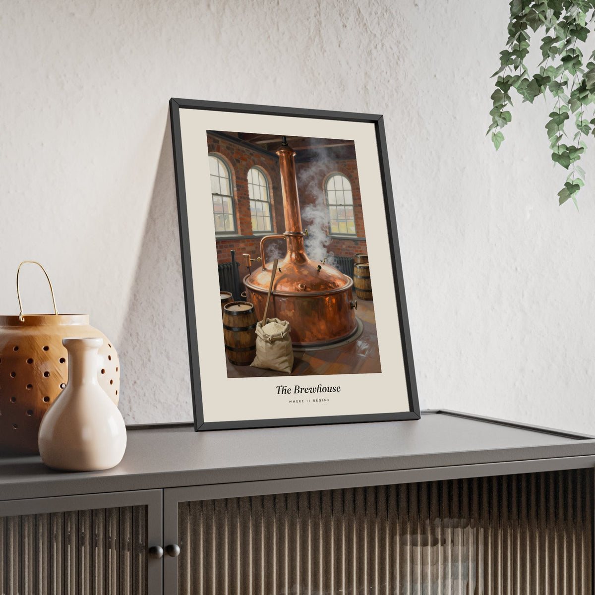 The Brewhouse Print framed and leaning on a sideboard