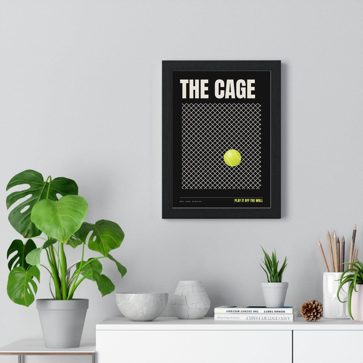 The Cage Padel print framed on a living room wall
