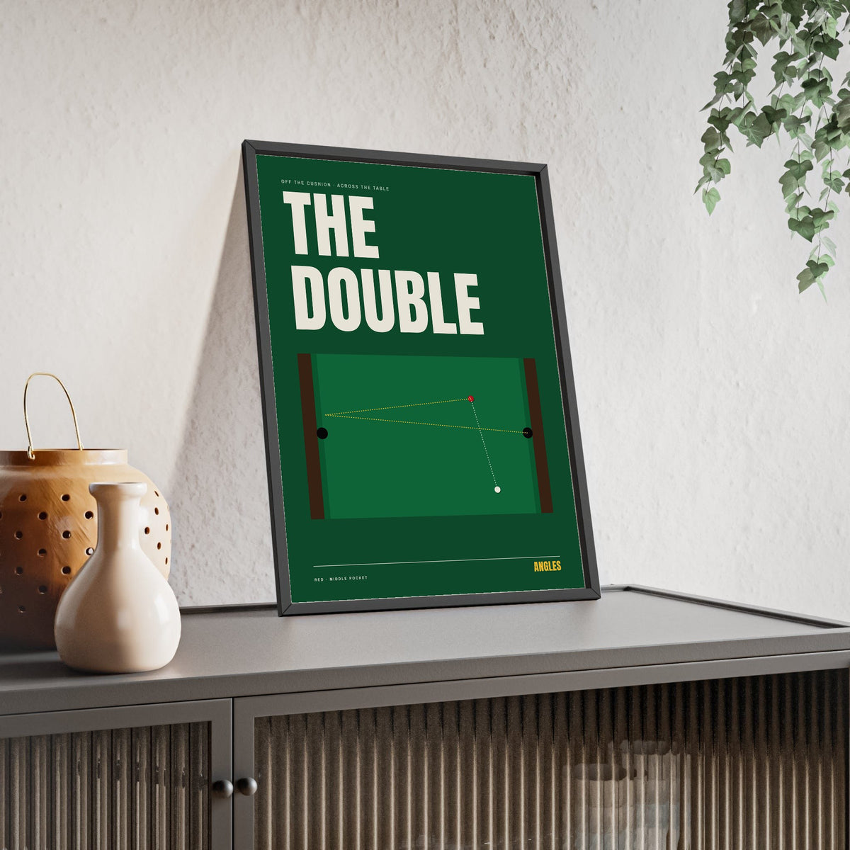 The Double Snooker print framed and leaning on a sideboard