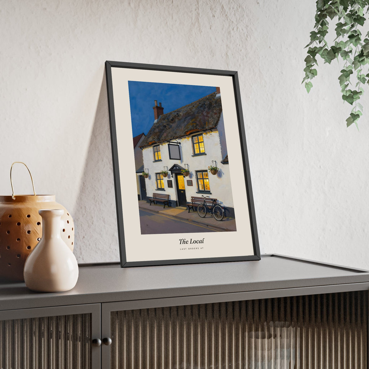 The Local Pub Print framed and leaning on a sideboard