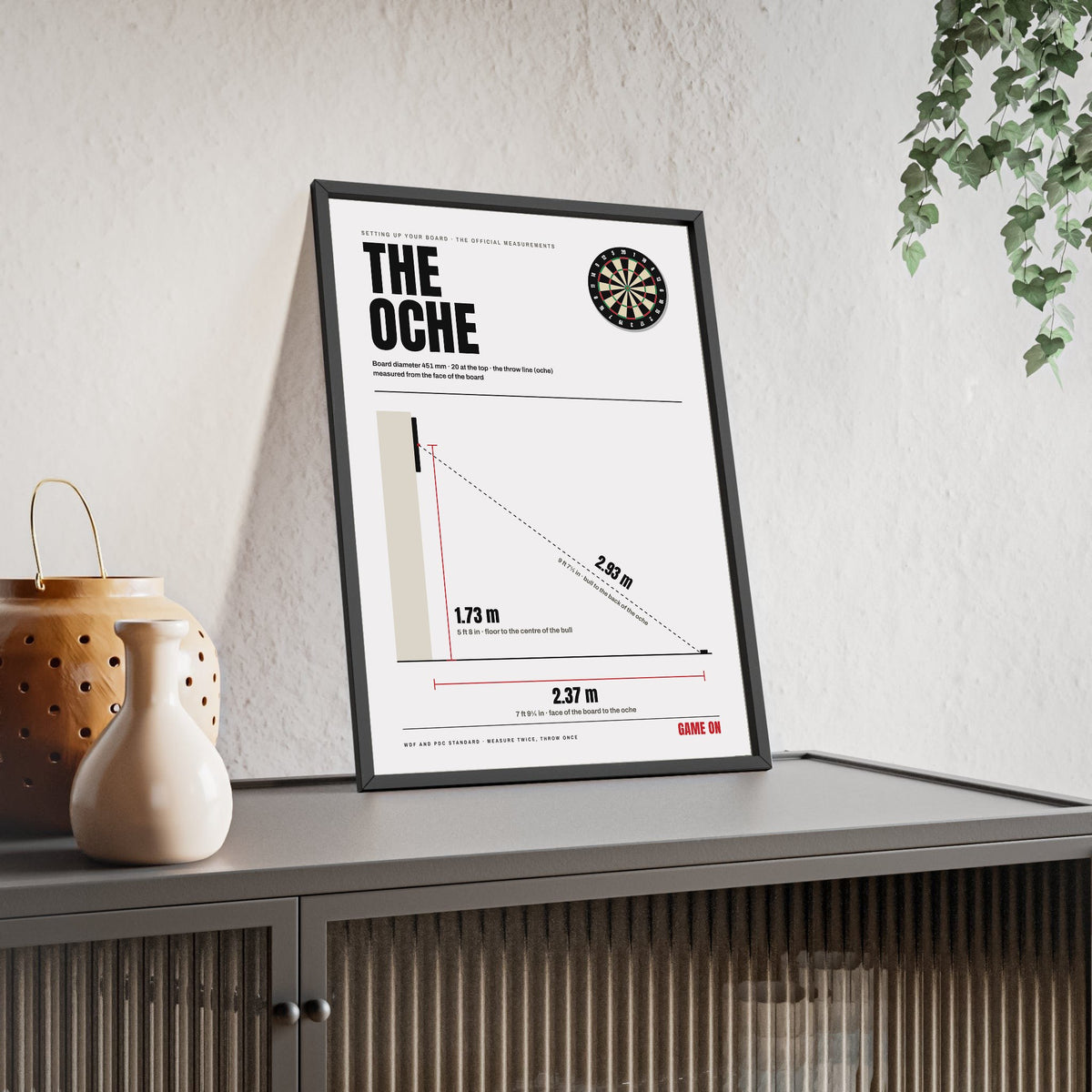 The Oche Darts print framed and leaning on a sideboard