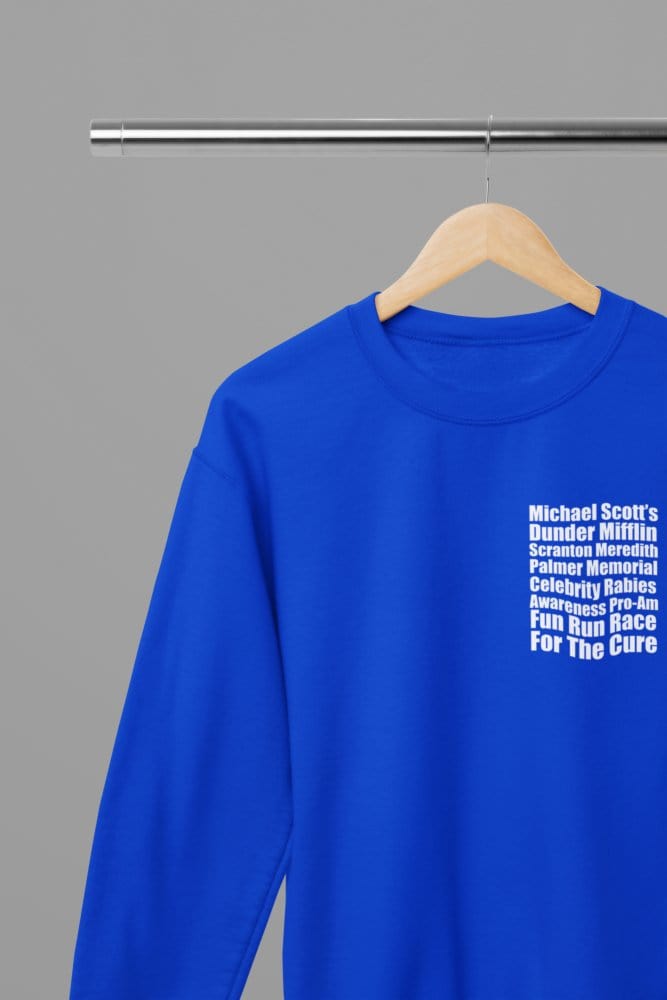 Blue t-shirt with The Office - Dunder Mifflin Rabies Awareness Shirt TV Show Apparel wall display