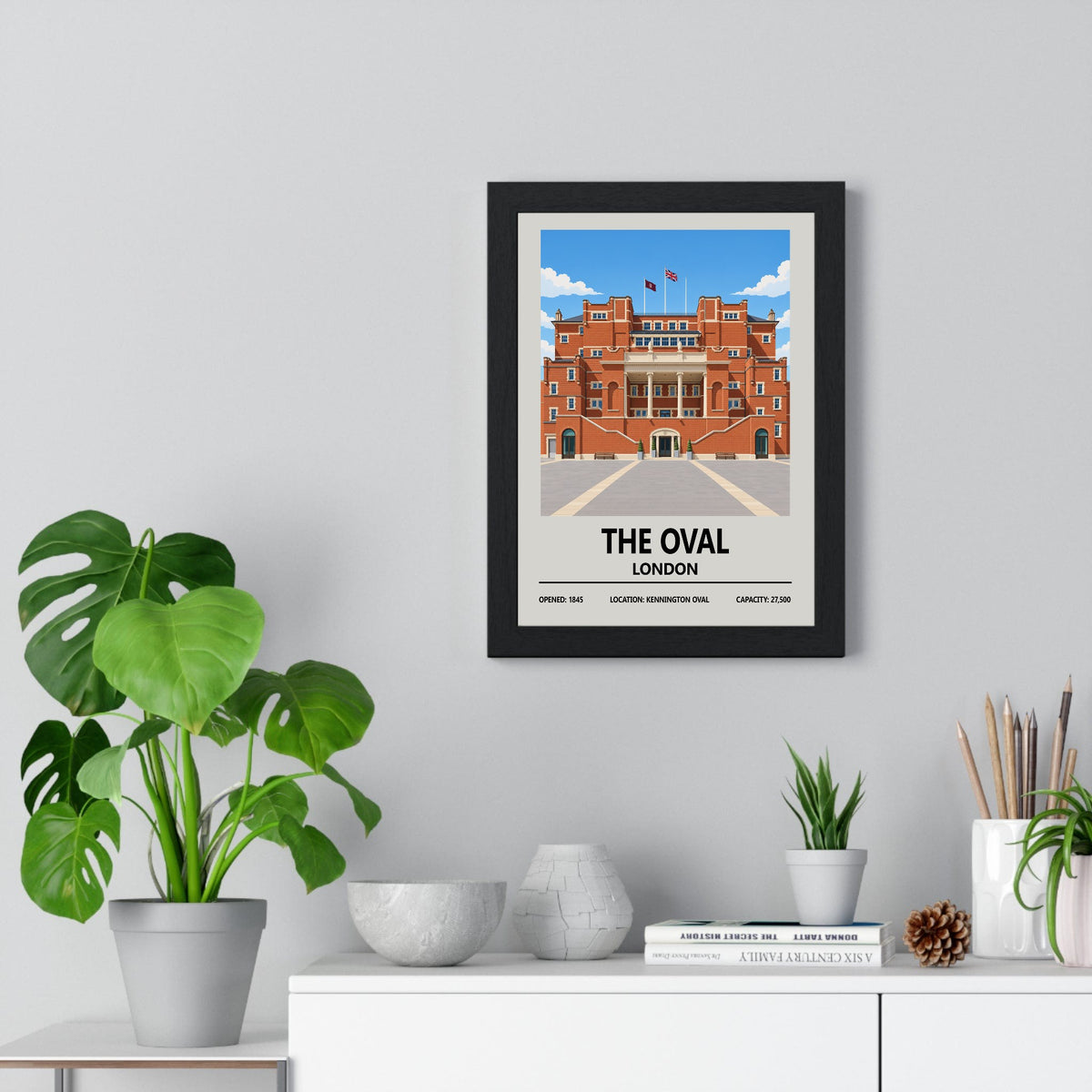 The Oval cricket ground print framed on a living room wall