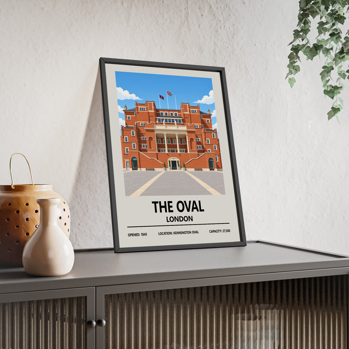 The Oval cricket ground print framed and leaning on a sideboard